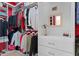 Well-organized walk-in closet featuring custom shelving and ample storage space for clothes and accessories at 7736 Brofield Ave, Windermere, FL 34786