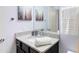 Updated bathroom featuring speckled countertop, sleek fixtures, and vanity at 8940 Rhodes St, Kissimmee, FL 34747