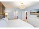 Bright and airy bedroom with an elegant lighting fixture and television at 8940 Rhodes St, Kissimmee, FL 34747