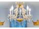 Close-up of a fancy, bright and ornate chandelier in a home at 8940 Rhodes St, Kissimmee, FL 34747