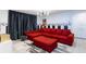 Living room features a red sofa with a black and white patterned wall at 8940 Rhodes St, Kissimmee, FL 34747