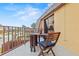 Cozy balcony with seating, offering a relaxing outdoor space with views of the neighborhood at 90 Cedar Dunes Dr, New Smyrna Beach, FL 32169