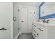 Stylish bathroom featuring a glass-enclosed shower, modern vanity, and sleek fixtures at 90 Cedar Dunes Dr, New Smyrna Beach, FL 32169