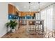 Bright kitchen with wooden cabinets, stainless steel appliances, and a kitchen island with barstool seating at 90 Cedar Dunes Dr, New Smyrna Beach, FL 32169