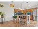 Well-lit kitchen with oak cabinets, stainless steel appliances, and a stylish center island with seating at 90 Cedar Dunes Dr, New Smyrna Beach, FL 32169