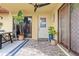 Cozy patio area with tile flooring, a ceiling fan, and sliding glass doors, creating an inviting outdoor space at 90 Cedar Dunes Dr, New Smyrna Beach, FL 32169