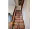 Stairway leads up to the next floor with tile steps and a wooden railing at 90 Cedar Dunes Dr, New Smyrna Beach, FL 32169