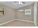 This bedroom features tile flooring, fan and an air conditioner at 906 Ferndell Rd, Orlando, FL 32808