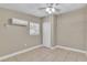 Simple bedroom with tile floors, a ceiling fan, a window, and closet for storage at 906 Ferndell Rd, Orlando, FL 32808