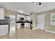 Bright kitchen with stainless steel appliances, white cabinets, and tile flooring at 906 Ferndell Rd, Orlando, FL 32808