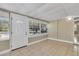 This sunroom's door has a half-moon design and the room has tile flooring at 906 Ferndell Rd, Orlando, FL 32808