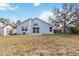 View of the home's backyard, featuring a shed and partial fencing at 9307 Echo Run, Orlando, FL 32817