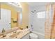 Full bathroom featuring a bathtub, shower, tile, and a framed mirror above the sink at 9307 Echo Run, Orlando, FL 32817