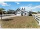 Exterior view of a one-story home with a two car garage and blue sky backdrop at 9307 Echo Run, Orlando, FL 32817