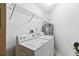 Dedicated laundry room with washer, dryer, shelving, and water heater at 9307 Echo Run, Orlando, FL 32817