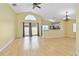 Spacious living room with wood floors, lots of natural light, and an open floor plan at 9307 Echo Run, Orlando, FL 32817