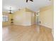 Large open living room with hard wood floors and lots of natural light at 9307 Echo Run, Orlando, FL 32817