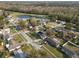 An aerial view showcasing the neighborhood, nearby pond, and the attractive landscaping surrounding this community's homes at 9544 Brimton Dr, Orlando, FL 32817