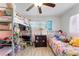 Bright bedroom featuring a bunk bed and updated light fixture at 9544 Brimton Dr, Orlando, FL 32817