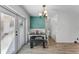 Well lit dining area with french doors, natural light, and wood-look tile floors at 9544 Brimton Dr, Orlando, FL 32817