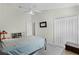 Neutral bedroom featuring a ceiling fan, large window, and full-sized bed at 9848 Nonacrest Dr, Orlando, FL 32832