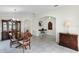 Neutral dining area featuring a wood table set, tiled floors, and neutral decor at 9848 Nonacrest Dr, Orlando, FL 32832