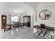 Spacious dining room featuring tiled floors, and a wooden table set in a neutrally decorated home at 9848 Nonacrest Dr, Orlando, FL 32832