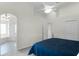 Bright main bedroom features a ceiling fan, neutral walls, and ensuite bathroom access at 9848 Nonacrest Dr, Orlando, FL 32832