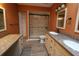 Bathroom featuring double sinks, a walk in shower with glass door, and neutral color palette at 1104 Southampton Dr # 3, Port Orange, FL 32129