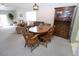 Inviting dining room featuring a wooden table set, bright lighting, and ample seating at 1104 Southampton Dr # 3, Port Orange, FL 32129