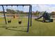 Playground with swings and slide and overlooking a community lake at 1104 Southampton Dr # 3, Port Orange, FL 32129