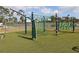 Neighborhood playground with climbing net and artificial turf at 1104 Southampton Dr # 3, Port Orange, FL 32129