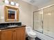 Bathroom featuring a granite countertop, a wood vanity, and a tiled shower and tub at 1110 W Ivanhoe Blvd # 5, Orlando, FL 32804