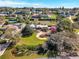 Lovely single-story home with well-manicured lawn and mature trees in a serene neighborhood at 12104 Lakeshore Dr, Clermont, FL 34711