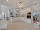 Bright white kitchen with stainless steel appliances and adjacent breakfast area at 12104 Lakeshore Dr, Clermont, FL 34711