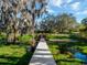 Scenic view of property with bridge and trees at 12104 Lakeshore Dr, Clermont, FL 34711