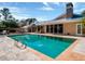 Large pool with a clear blue water and serene backyard landscaping at 12104 Lakeshore Dr, Clermont, FL 34711