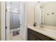 Clean bathroom with modern vanity, tile floor, and a shower-tub combination with neutral tones at 1324 Arklow Cir, Ormond Beach, FL 32174