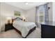 Cozy bedroom with a plush bed, stylish nightstands, and soft, neutral decor at 1324 Arklow Cir, Ormond Beach, FL 32174