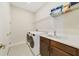 Laundry room with modern washer and dryer and cabinet with sink at 1324 Arklow Cir, Ormond Beach, FL 32174