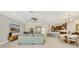 Open concept living room flowing into a kitchen and dining area, offering a cohesive living space at 1324 Arklow Cir, Ormond Beach, FL 32174