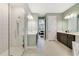 Bright and airy main bathroom with walk-in shower, dual sinks, and neutral color palette at 1324 Arklow Cir, Ormond Beach, FL 32174