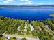 An aerial view of a beautiful lakefront property, featuring mature trees and private docks at 13344 S Lake Mary Jane Rd, Orlando, FL 32832