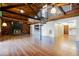 Cozy living room features a fireplace, unique spiral staircase, and wood floors at 13344 S Lake Mary Jane Rd, Orlando, FL 32832