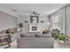 Relaxing living room showcasing tile floors, a cozy fireplace, and comfortable gray sofas for Gathering gatherings at 1465 Osprey Ridge Dr, Eustis, FL 32736