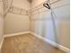 Empty walk-in closet with wire shelving and carpeted floor at 15209 Lake Lamonia St, Winter Garden, FL 34787