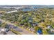 Expansive aerial view of a residential neighborhood near a lake and cityscape, showcasing the area's natural beauty and location at 1523 Silver Star Rd, Orlando, FL 32804