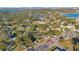 This captivating aerial perspective highlights a charming residential area conveniently located near the picturesque lake at 1523 Silver Star Rd, Orlando, FL 32804