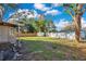 Partially fenced backyard includes lush trees and shed at 1523 Silver Star Rd, Orlando, FL 32804