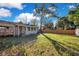 Backyard features lush lawn and partial fencing at 1523 Silver Star Rd, Orlando, FL 32804